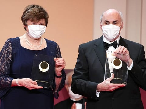 Japan Prize 2022 Laureates Hungarian-American biochemist Katalin Kariko (L) and American physician-scientist Drew Weissman pose with their trophy during the Japan Prize presentation ceremony in Tokyo on April 13, 2022. Katalin Kariko (Hungary) and Drew Weissman (US) have won the Nobel Medicine Prize for mRNA vaccine research, the Nobel committee announced on October 2, 2023 in Stockholm. 