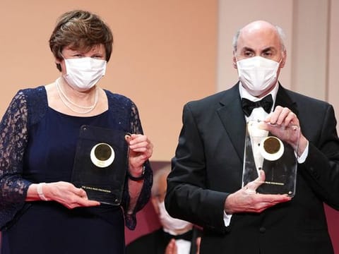 Japan Prize 2022 Laureates Hungarian-American biochemist Katalin Kariko (L) and American physician-scientist Drew Weissman pose with their trophy during the Japan Prize presentation ceremony in Tokyo on April 13, 2022. Katalin Kariko (Hungary) and Drew Weissman (US) have won the Nobel Medicine Prize for mRNA vaccine research, the Nobel committee announced on October 2, 2023 in Stockholm. 