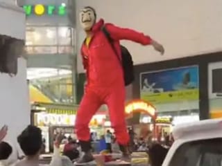 Viral video: Man dressed in ‘Money Heist’ costume showers cash on crowd, arrested