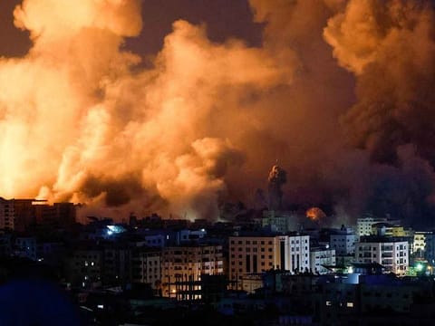Flames and smoke billow during Israeli strikes in Gaza, October 9, 2023.