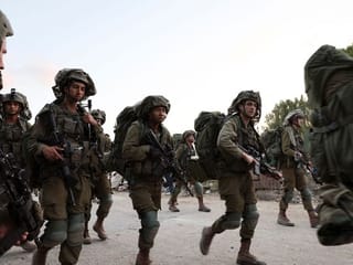 Photos: Israel bolsters troops at border with Gaza

