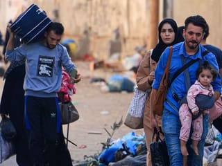 Photos: Thousands of Palestinians flee north Gaza after Israel evacuation warning