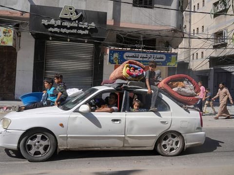 Palestinians flee to the southern Gaza Strip after the Israeli army issued an evacuation warning to a population of over 1 million in northern Gaza and Gaza City to seek refuge in the south ahead of a possible Israeli ground invasion.