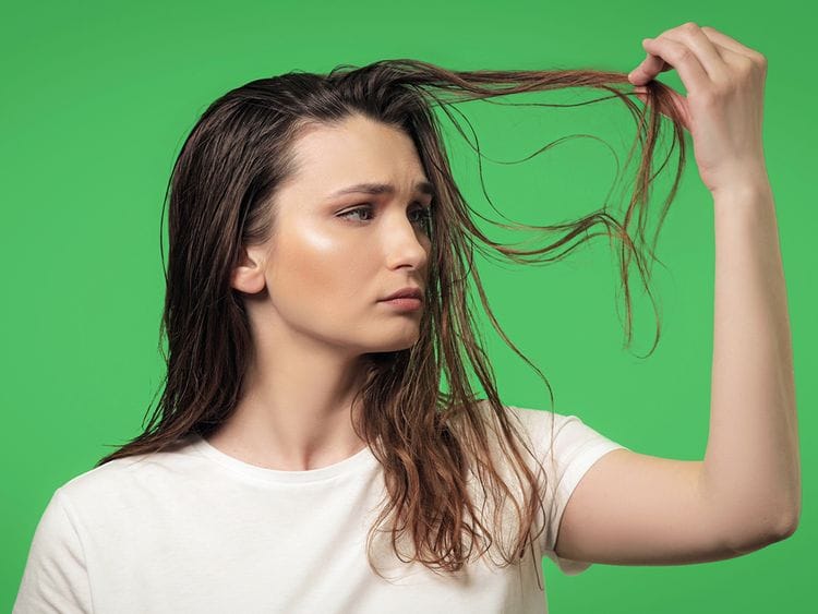 oily hair stock