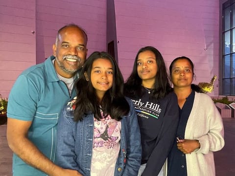 Magesh Kumar Natarajan (left) with family 