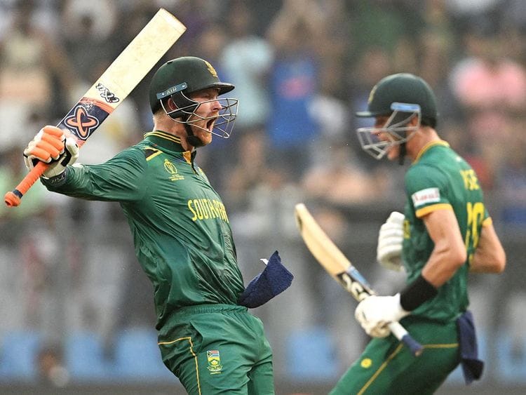 South Africa's Heinrich Klaasen (L) celebrates after scoring a century next to Marco Jansen 