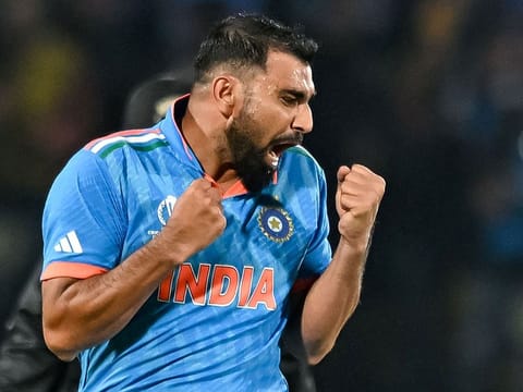 India’s Mohammed Shami celebrates after taking the wicket of New Zealand’s Matt Henry during the 2023 ICC Men's Cricket World Cup match at the Himachal Pradesh Cricket Association Stadium in Dharamsala on October 22, 2023. Shami returned a haul of wickets as India won by five wickets to maintain their unbeaten streak in the tournament. 