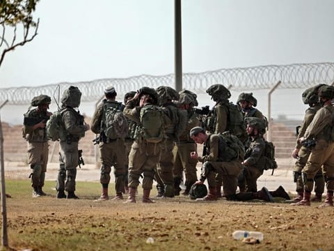 Israeli soldiers patrol along the border with the Gaza Strip, in the aftermath of a Palestinian militant attack on October 7.  