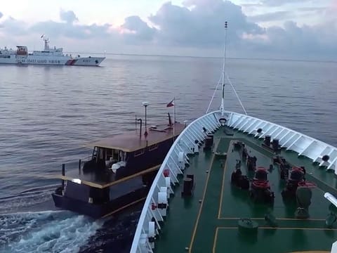 In this video grab taken from a video on October 22, 2023 and released by the Chinese Coast Guard (CCG) through the Chinese embassy in Manila on October 23, 2023 shows a collision between Chinese Coast Guard ship (R) and Philippines' resupply boat (L) during a resupply mission in Second Thomas Shoal, in the disputed South China Sea. 