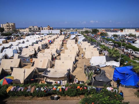 Tents for internally displaced Palestinians at a camp, operated by the United Nations Relief and Works Agency (UNRWA), in western Khan Younis, Gaza, on Friday, Oct. 20, 2023. Israel said it will step up aerial strikes over Gaza in preparation for the "next stage" of its military operation, likely a ground invasion. Photographer: Ahmad Salem/Bloomberg