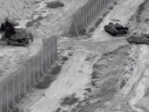 Israeli armoured vehicles take part in an operation, as the conflict between Israel and Hamas continues, at a location given as the northern Gaza Strip.