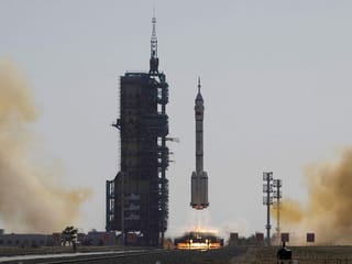 Photos: China sends three astronauts to space station