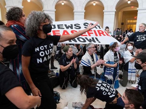 Members of the US Jewish community protest against the Israeli military operation in Gaza inside the Cannon building in the US Capitol in Washington, DC on October 18, 2023 
