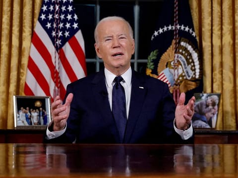 US  President Joe Biden delivers a prime-time address to the nation about his approaches to the conflict between Israel and Hamas, humanitarian assistance in Gaza and continued support for Ukraine in their war with Russia, from the Oval Office of the White House in Washington, U.S. October 19, 2023. 