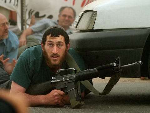 Armed Israeli settlers in the Palestinian territory (File)