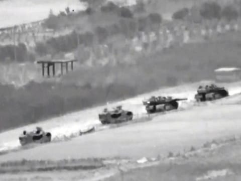 A line of Israeli tanks are shown during an incursion into the Gaza Strip.  