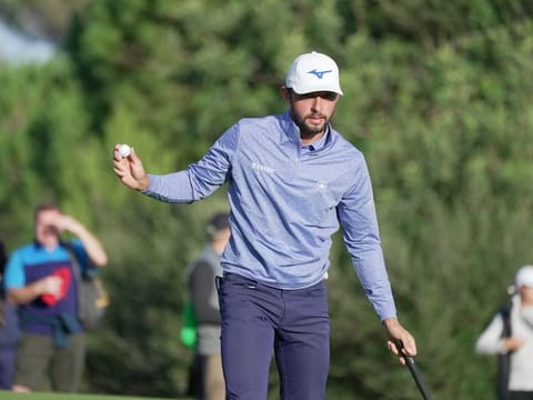 England's Marco Penge holing his birdie putt on the 17th hole