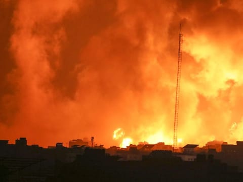 Fire and smoke rises from buildings following Israeli airstrikes on Gaza City, on November 5, 2023.  