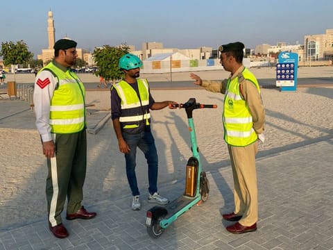 Dubai Police honours responsible drivers 'Scooter Hero' with pin.