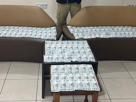 Police display the recovered cash