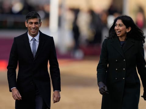 Britain's Prime Minister Rishi Sunak, left, and Suella Braverman at the ceremonial welcome for the President of South Africa Cyril Ramaphosa at Horse Guards Parade in London on November 22, 2022.  