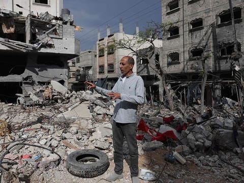 Palestinian Jamal Al Durra, the father of 12-year-old Mohammed al-Durra, who was filmed on September 30, 2000, dying in his wounded father's arms after they were caught in the midst of a gun battle during Israeli-Palestinian clashes in Netzarim in the Gaza Strip at the time - speaks outside his destroyed homes in Bureij, in the central Gaza Strip