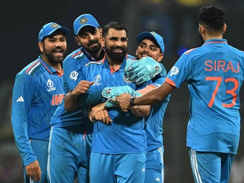 India’s Mohammed Shami (third from right) celebrates with teammates after taking the wicket of New Zealand captain Kane Williamson during the ICC Men's Cricket World Cup semi-final at Wankhede Stadium in Mumbai on Wednesday. 