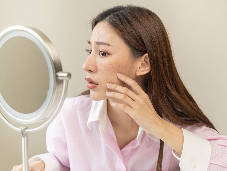 Person checking out her skin