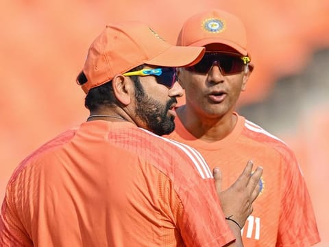 India’s captain Rohit Sharma (left) interacts with coach Rahul Dravid during a practice session at the Narendra Modi Stadium in Ahmedabad on November 17, 2023, ahead of the 2023 ICC Men's Cricket World Cup final match against Australia on November 19. 