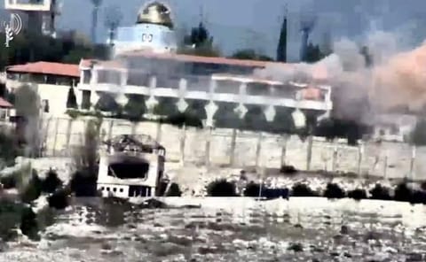 A strike on what Israel military says is a Hezbollah target in a location given as Lebanon is seen in this screengrab taken from a handout video obtained by Reuters on November 20, 2023.  