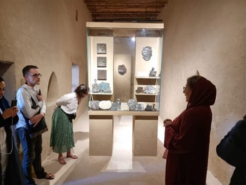 Various works by Nujoom (right) are on display in multiple rooms at the Fort
