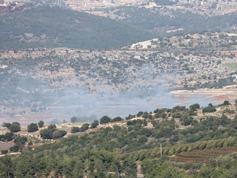 Smoke billows from an area targetted in a rocket strike by Lebanese Hezbollah militants on November 23, 2023, near Israel's border with Lebanon amid increasing cross-border tensions as fighting continues with Hamas militants in the southern Gaza Strip.  