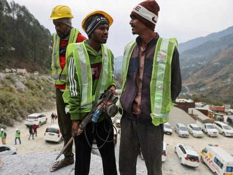 "Rat miners" stand before they begin manual drilling as rescue operations are in progress after workers got trapped in a collapse of an under-construction tunnel, in Uttarkashi in the northern state of Uttarakhand on November 27, 2023.  