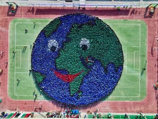 Look: Indian school in UAE creates largest human image of Earth to get Guinness record ahead of COP28
