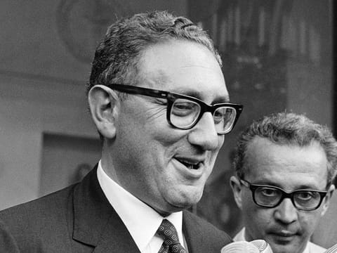 Henry Kissinger, Special Advisor to President Nixon on Security Affairs, addresses journalists after his interview with Maurice Schumann in Paris on August 4, 1969
