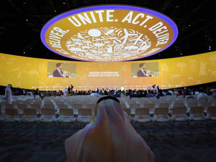 An attendee inside a panel session on day three of the COP28 climate conference at Expo City in Dubai, United Arab Emirates, on Saturday, Dec. 2, 2023.