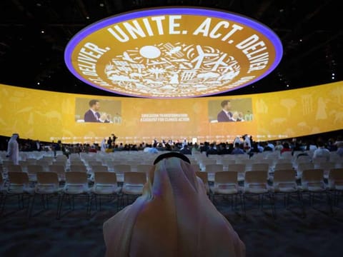 An attendee inside a panel session on day three of the COP28 climate conference at Expo City in Dubai, United Arab Emirates, on Saturday, Dec. 2, 2023.