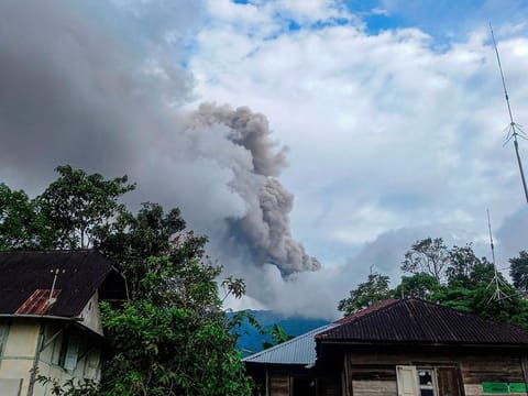 Mount Merapi volcano spews volcanic ash as seen from Nagari Sungai Pua, in Agam, West Sumatra province, Indonesia