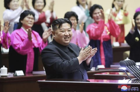 Kim Jong Un applauds in the National Mothers’ Meeting in Pyongyang on December 3, 2023.  