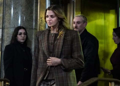 Grace Jabbari, second from left, the accuser in the assault case against Jonathan Majors, leaves court after giving testimony, Tuesday, Dec. 5, 2023, in New York. (AP Photo/Bebeto Matthews)