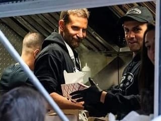 Bradley Cooper serves cheesesteaks at food truck in New York City