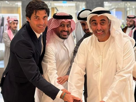 Marwan Bin Yousef Al Serkal (centre) with polo player Nacho Figueras 