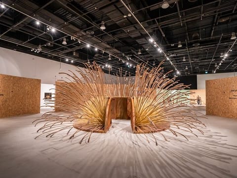 The exhibition "Rooted: Sustainability - an Art Perspective", includes “Dome Path,” by Emirati artist Azza Al Qubaisi, inspired by palm tree branches and integrated with stainless steel, which reflects a deep connection to the UAE’s past.