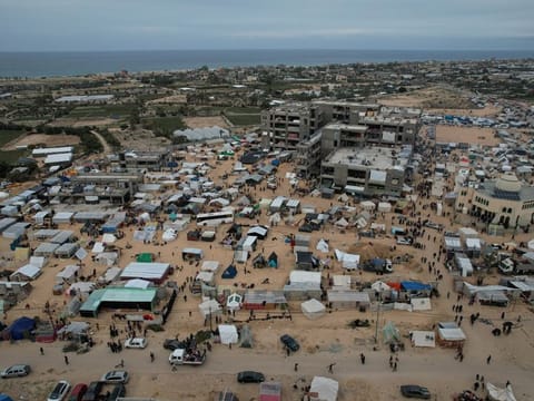 Displaced Palestinian families live in tents in the Al Mawasi area of Rafah, situated south of the Gaza Strip and near the border with Egypt, on December 7, 2023.  