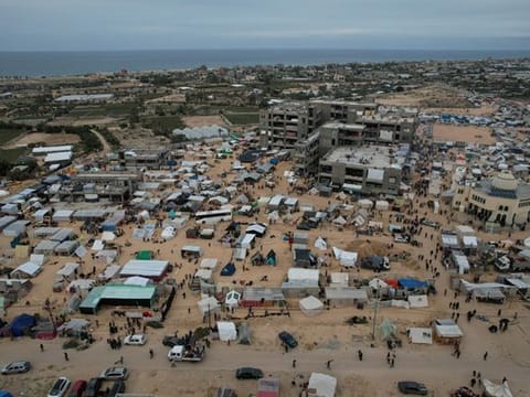 Displaced Palestinian families live in tents in the Al Mawasi area of Rafah, situated south of the Gaza Strip and near the border with Egypt, on December 7, 2023.  