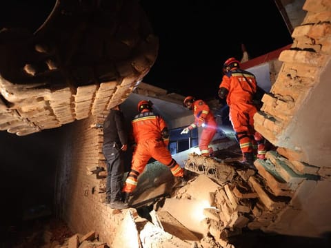 Rescue workers search a house for survivors after an earthquake in Kangdiao village, Dahejia, Jishishan County, in northwest Chinas Gansu province on December 19, 2023.  