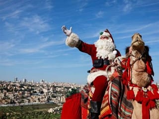 In Pictures: Santa Claus spreads Christmas cheer around the world