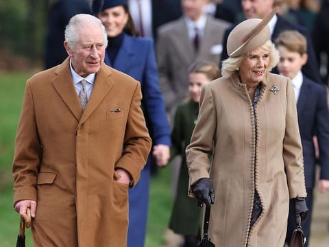 Britain's King Charles III (L) and Britain's Queen Camilla (R) arrive for the Royal Family's traditional Christmas Day service at St Mary Magdalene Church in Sandringham in eastern England, on December 25, 2023. 
