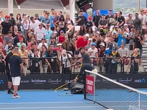 Play was halted until a snake catcher arrived and managed to tease it into a bag.