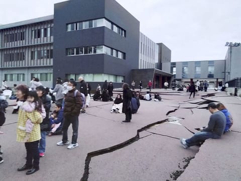 Road cracks caused by an earthquake is seen in Wajima, Ishikawa prefecture, Japan January 1, 2024, in this photo released by Kyodo. 